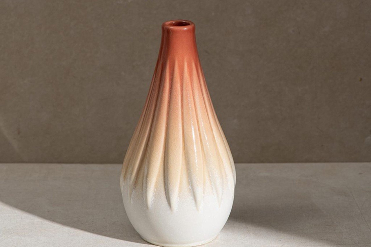 Rookwood Pottery Bud Vase
This sweet and simple little flower bud vase was handcrafted by Rookwood artist and ceramicist Morgan Willenbrink. Rookwood says, "The Flora Bud Vase is named for Flora, the Roman goddess of flowers and spring. Its shape is inspired by the soft, cascading petals on some of Morgan&#146;s favorite flowers." It&#146;s designed to hold two to three stems and comes in three different colors.
Photo via rookwood.com