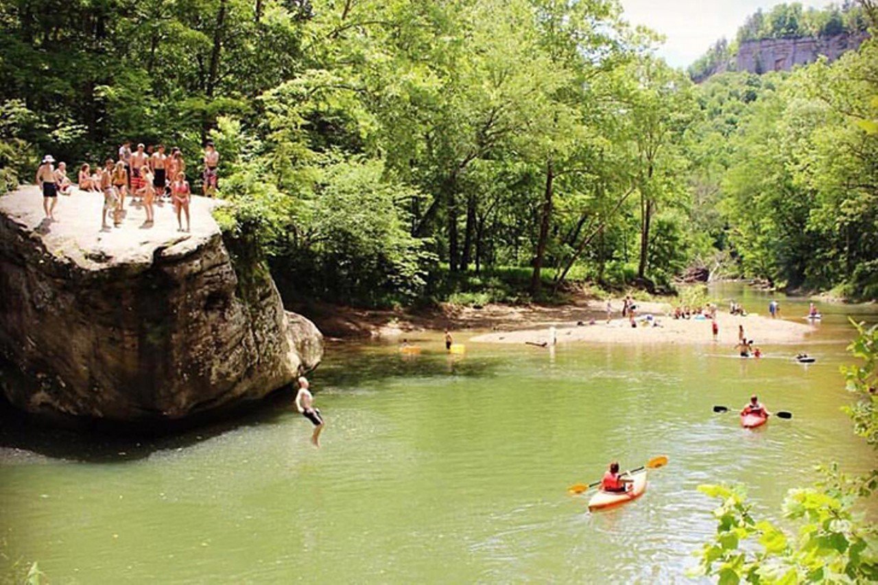 Jump Rock Swimming Hole
Robbie Ridge Road, Stanton, Kentucky
Distance: 2 hours
Jump Rock is a famous spot to those familiar with Red River Gorge. Drive into the RRG Geological Area and soon after passing through Nada Tunnel, park at the Sheltowee Trace Trail parking lot. Hike the short trail and cross the suspension bridge over Red River to gain access to the small sand beach and the best swimming hole in the gorge.
Photo via Facebook.com/OfficialRedRiverGorge