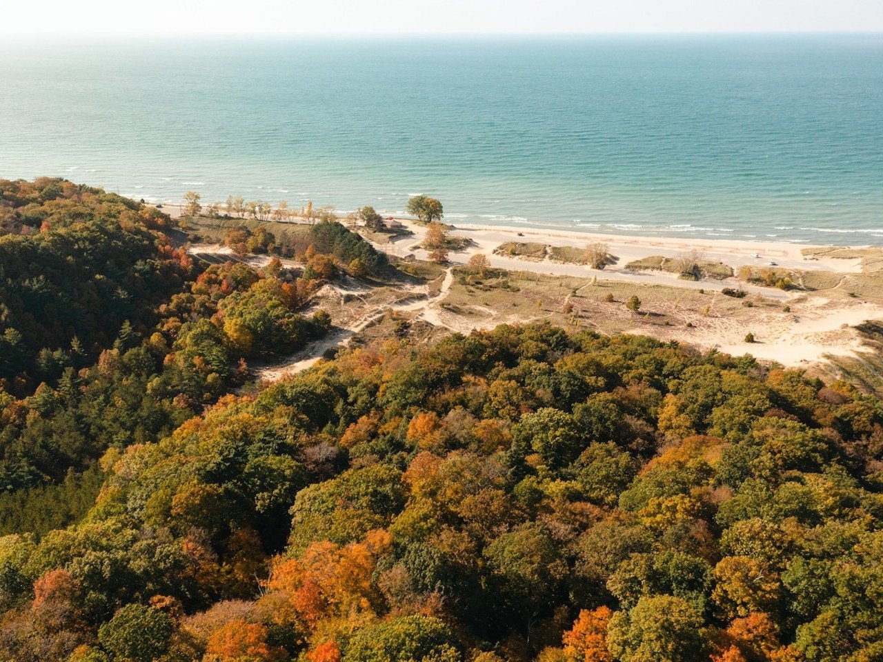 Saugatuck, Michigan
Distance: 5 hours 
For a beautiful fall getaway along the shores of Lake Michigan, travel to Saugatuck, Michigan. Hit the water in the Star of Saugatuck paddlewheel boat for a tour of fall colors this October, or head out to Saugatuck Dunes State Park to hike the beaches. You can also explore the dunes in a buggy with Saugatuck Dune Rides. For a more relaxed trip, go on a wine-tasting tour at spots like Modales and Fenn Valley Vineyards, or indulge in some retail therapy at downtown Saugatuck’s boutiques.