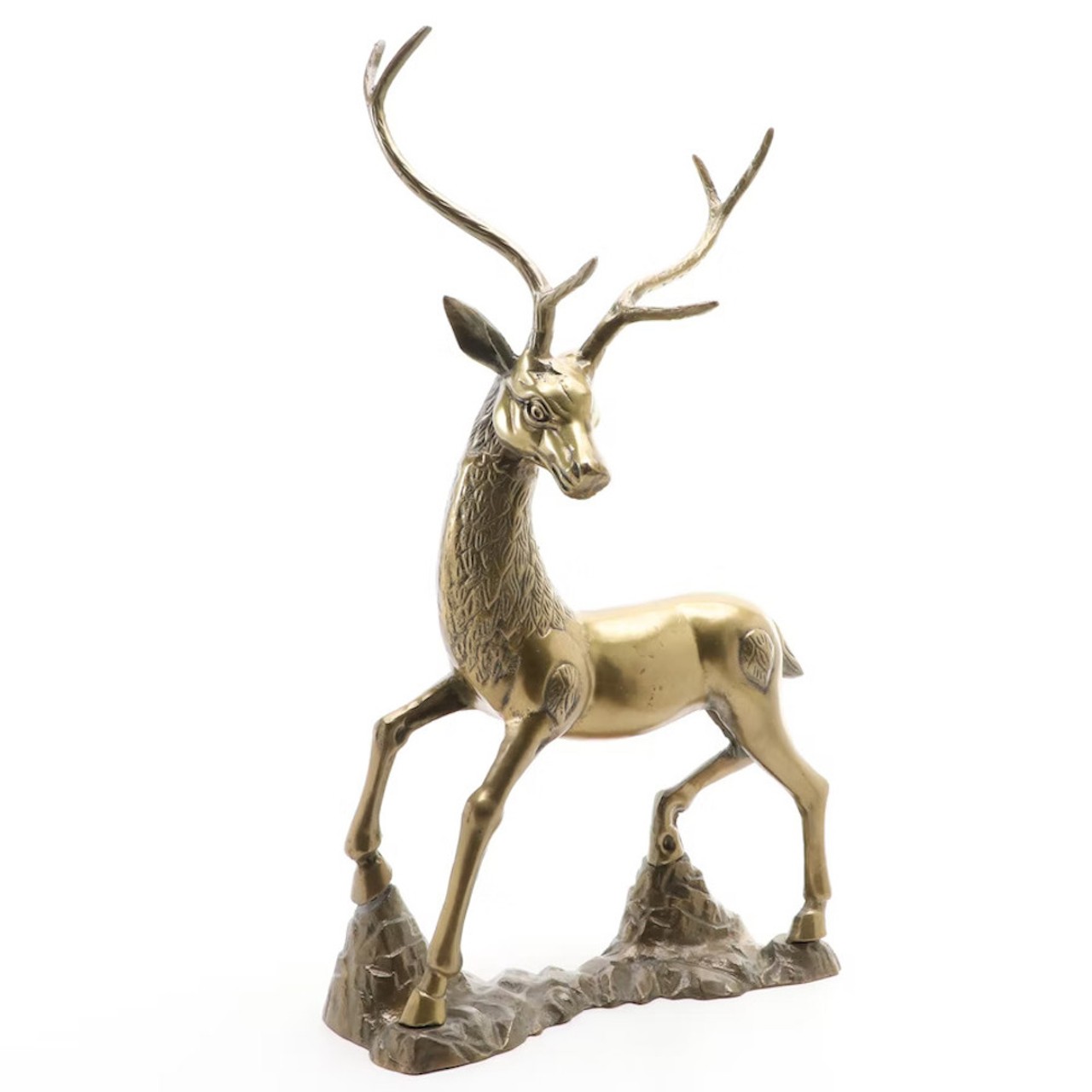 Middle Eastern Style Brass Standing Stag
A piece of holiday decor worth gifting is this solid brass stag. Brass is all the rage for interior decorating right now and this stag can double as holiday decor with the right staging. Make a small wreath with some faux greenery and ribbon to hang around the stag’s neck, or place small ornament bulbs on his antlers. Bonus points if you include those bottle-brush trees in the dollar section at Target.