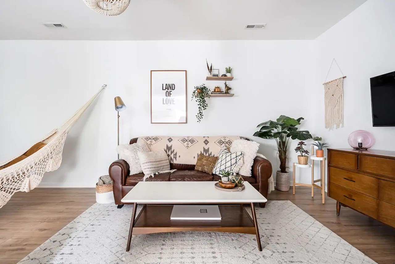 Retreat to a Boho Chic Guesthouse in a Leafy Family Suburb
Sleeps: 4 guests // Price: Starts at $87
"Laze away an evening swaying in a macrame hammock in a living room with a Moroccan vibe. Make breakfast in a sparkling white kitchen and snuggle together on a cozy banquette."