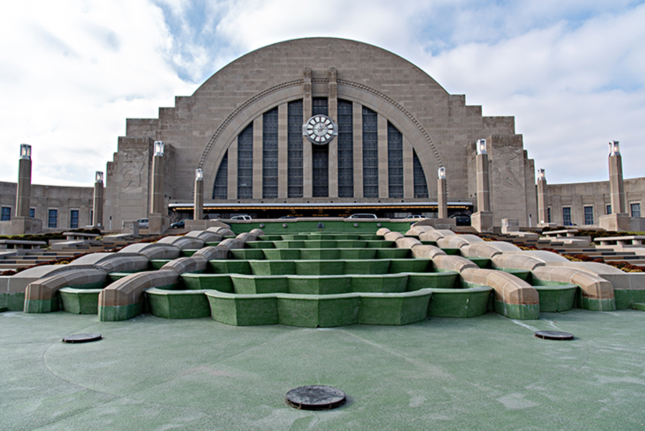 The Fact the Super Friends’ Hall of Justice is Based on Union Terminal
Not only is Union Terminal a gorgeous Art Deco train station-turned-museum, it was also the inspiration for the Super Friends’ Hall of Justice, as any Cincinnatian will be more than happy to point out to you. After ABC acquired the rights to DC Comics characters in 1973, they partnered with Hanna-Barbera to adapt the Justice League comic books into a cartoon. Hanna-Barbera background supervisor Al Gmuer was then tasked with creating a “grand headquarters” for the Super Friends, which he then modeled after our landmark, later saying the task of drawing the building gave him nightmares. And while Union Terminal may be a nightmare to draw, she’s also damn pretty and was recently immortalized as a U.S. postal stamp.