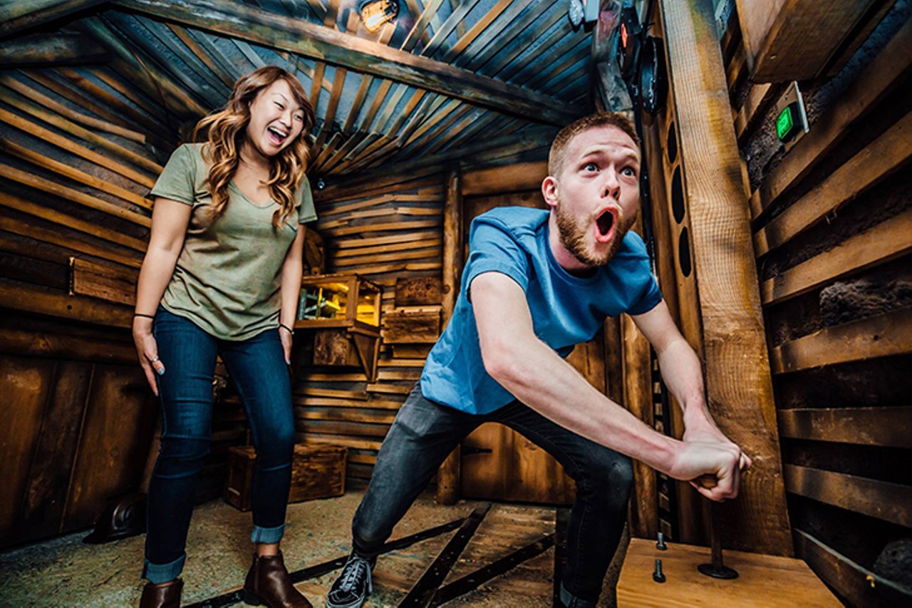 Break out of an escape room at The Escape Game at The Banks
28 West Freedom Way, Suite 300, The Banks
The Escape Game at The Banks is just one of the many escape room challenges in which one can lock themselves in Cincinnati. But it may also be one of the best. With high-quality Rube Goldberg-like sets, gamers can choose from four room themes: Prison Break, Gold Rush, Special Ops: Mysterious Market and The Heist (an art museum-themed adventure). Each room has a difficulty ranking (out of 10) and you have 60 minutes to solve your way out with two to eight players. Room hosts can provide up to three clues via a screen if you get stuck.
Photo via Facebook.com/TheEscapeRoomCincinnati