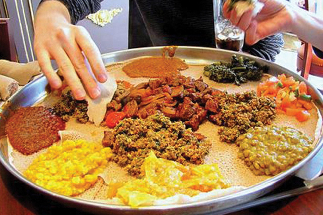 Elephant Walk Injera & Curry House
170 W. McMillan St., Clifton
Clifton&#146;s Elephant Walk Injera & Curry House does double duty as both an Indian and Ethiopian restaurant. The two-sided menu features cuisine from both countries, which have somewhat similar flavor profiles. If you&#146;ve never eaten Ethiopian food, it&#146;s kind of like Indian &#151; both offer stew-style dishes consisting of ingredients like chicken, lentils, cabbage and lamb, but Ethiopian dishes also rely heavily on beef, which you won&#146;t see in Indian cuisine. Both also have their own special breads with which to scoop your food, but instead of naan, Ethiopian food is served with injera, a sourdough flatbread with a spongy texture and slightly tart taste that you will either love or really, really hate. The multiple vegetarian dishes &#151; many of which are also vegan &#151; are best enjoyed on a combo platter, served on a bed of injera with yellow lentils, seasoned collard greens, red lentils and cabbage.
Photo: CityBeat Archive