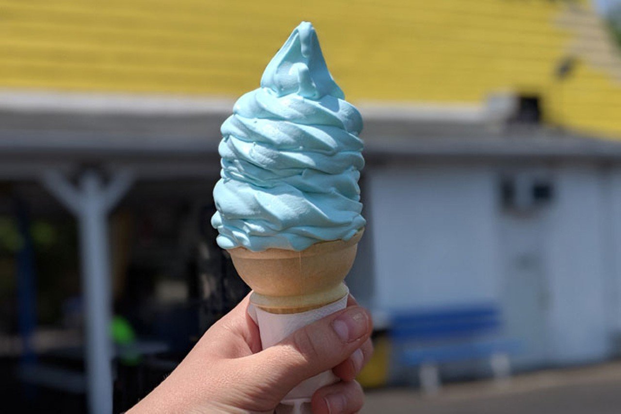 Eat Blue Creamy Whip
2673 Putz's Place, Westwood
If you’ve lived in Cincinnati for any length of time, chances are you can distinctly recall the taste of blue ice cream. A blueberry-based soft serve, the actual name of the flavor is known as simply just “blue.” Introduced by Kings Island in 1982 to promote a then-new Smurfs ride in the park’s Hanna-Barbera Land, it’s become a quintessential Queen City summer treat. Thankfully, the cult following for the dessert is as rich as its flavor, so you can grab a cone at most local creamy whip windows, like Putz’s Creamy Whip in Westwood. Although blue creamy whip varies slightly at each location — with many shops implementing special (and secret) twists — the treats taste nearly identical, staying faithful to the amusement park’s true-blue recipe.