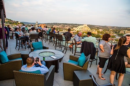 Top of the Park506 E. Fourth St., DowntownFor a stunning, nearly-360-degree view of downtown Cincinnati and its riverfront, plus some amazing craft cocktails, snag the elevator in the lobby of The Phelps hotel and take it to the very top where you’ll find one of the best rooftop bars in the city. Top of the Park is intimate, with plenty of comfy seating, including a glass bar top where you sit with your drink and enjoy the bird’s-eye view. Grab a Rooftop Lemonade (Ketel One Citroen, muddled strawberries, fresh lemon juice and wild berry simple syrup) and toast to an amazing summer ahead.