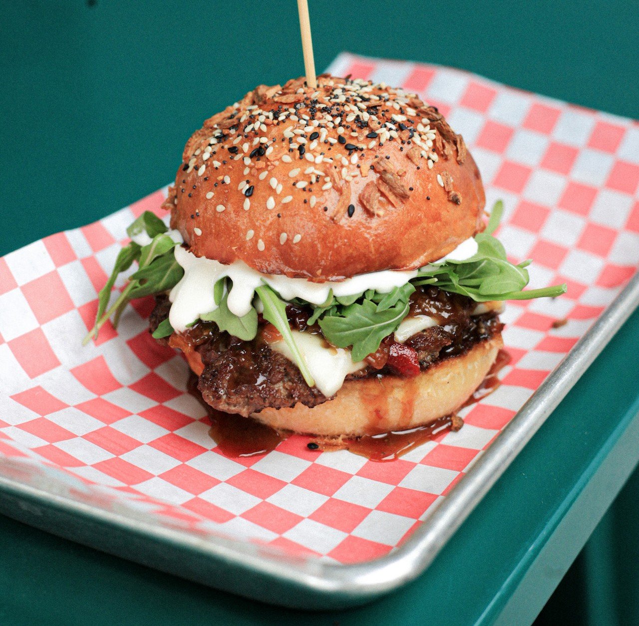 Proud Hound
6717 Montgomery Road, Silverton
Brekkie Burger: Fischer Farms smashed beef patty topped with white American cheese, bacon-onion-pepper jam, whipped quark cheese and arugula on an everything-seasoned milk bun.