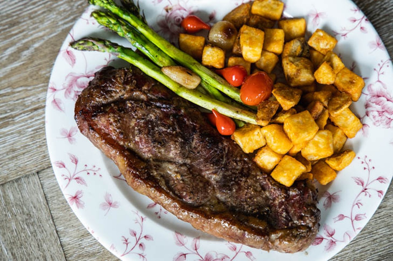 King Edward's Strip Steak: 10 oz. prime NY strip steak with house steak seasoning and home fries