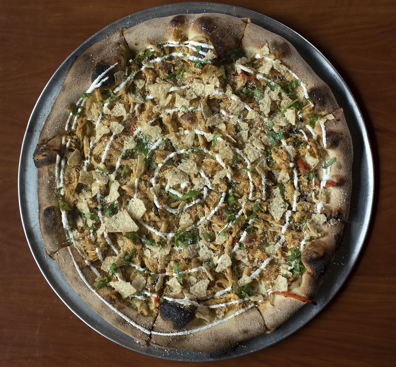 Fireside Pizza
773 E. McMillan St., Walnut Hills
Taquito Pizza: A 10-inch pizza with house-made salsa verde, shredded chicken, charred onions and peppers and Chihuahua cheese, garnished with cotija cheese, house-made lime crema, cilantro and tortilla chips.
