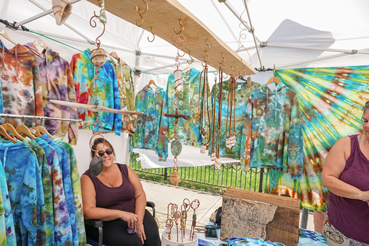 Sunny Corner Studio with a booth filled with tie dye and jewlry