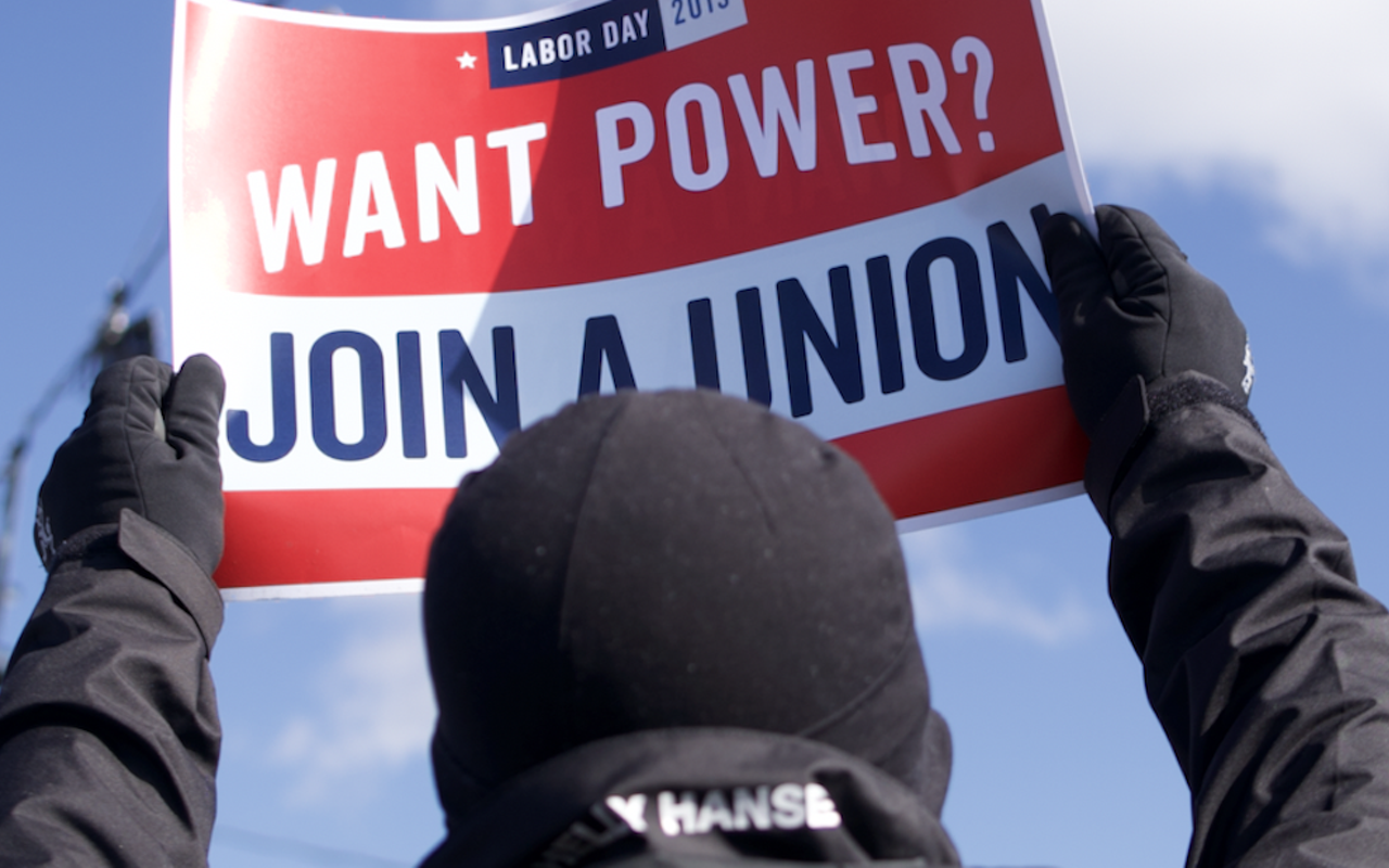 A demonstrator holds a pro-union sign outside KCVG in Hebron, Kentucky on March 18.