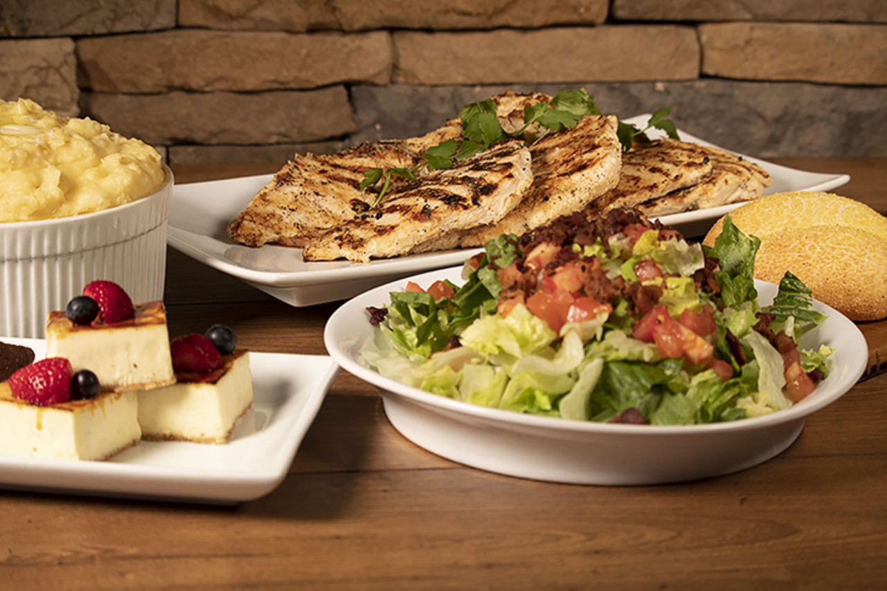 Firebirds Wood Fired Grill
Marinated wood-grilled chicken breasts with Parmesan mashed potatoes and smoked tomato jack cheese sauce (on side), served with your choice of a mixed greens or BLT salad 
Photo: Provided by Firebirds