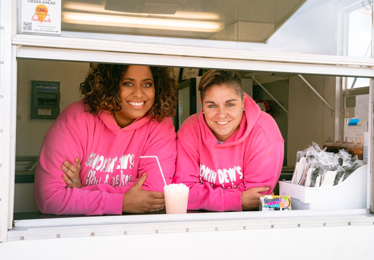 Smokin' Dews owners Darbi (right) and Ghiovanna Dennis (left). Darbi is the brains behind the menu, while Ghiovanna handles marketing and booking. Ironically, Darbi had never been a fan of barbecue until purchasing the food truck. When the couple realized that their new food truck came equipped with two 55-gallon barrel smokers, they decided to run with the idea of crafting a menu around barbecue.