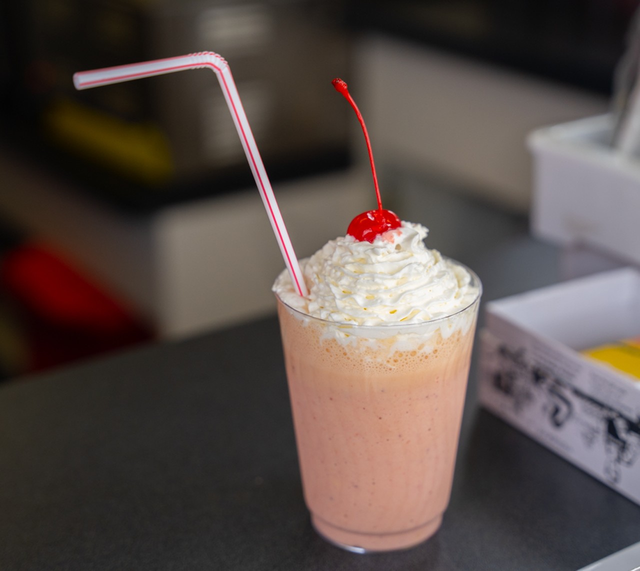 Smokin' Dews' Strawberry Dew Whip: Vanilla ice cream blended with frozen strawberries, topped with strawberry juice and whipped cream.