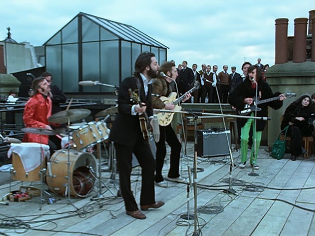 A still from The Beatles: Get Back — Rooftop Concert.