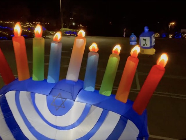 The city's first drive-thru Hanukkah light display is on view at Rockwern Academy in Kenwood
