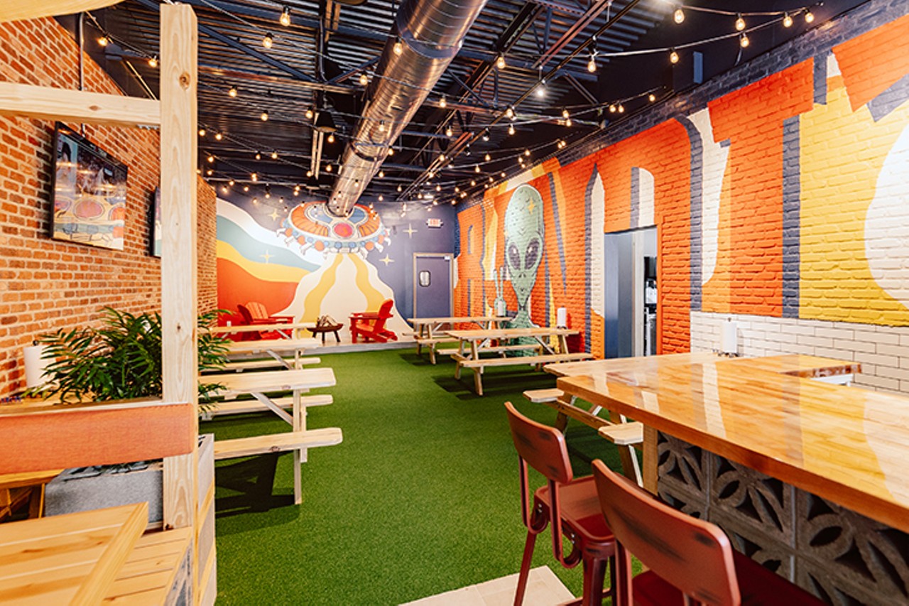 To make the inside feel like the outdoors, the restaurant features picnic tables, fake turf floors and string lights.