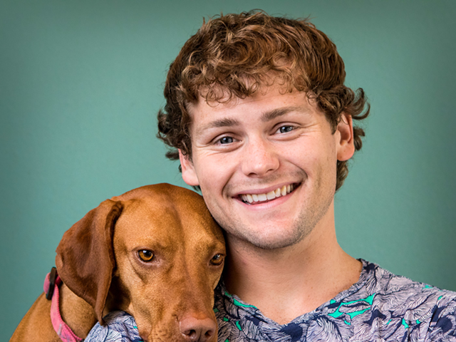 Comedian Drew Lynch and his service dog, Stella.