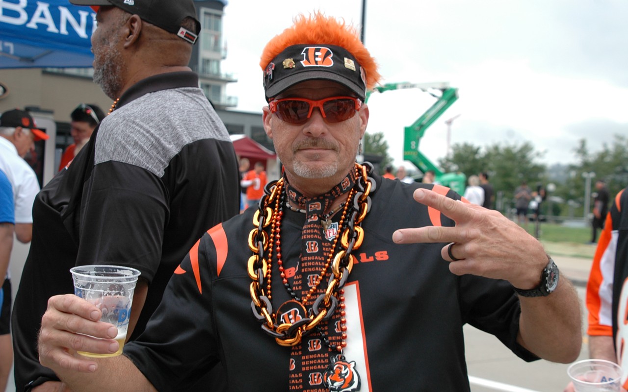 A Cincinnati Bengals fan celebrates during a tailgate before the season opener on Sept. 11, 2022.