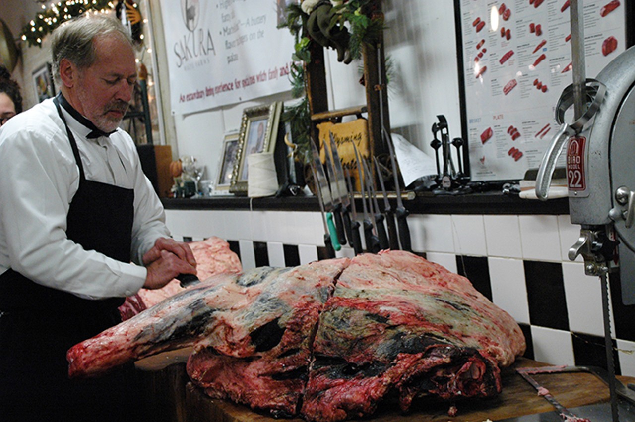 Shop owner Jim Gelhausen butchering the forequarter