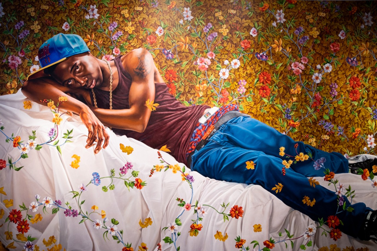 Kehinde Wiley's larger-than-life "Morpheus" hangs above the 21c's front desk. Wiley combines police mug shots, 18th and 19th century portraiture and the poses/gestures used by European Old Masters to influence his work. The man in "Morpheus" is found lounging by vibrant flowers in the likeness of the piece's namesake. Of his work, Wiley said that this: "Ultimately, what I'm doing is jacking history. I&#146;m emptying out the original. It&#146;s almost a type of drag in a way.&#148;
