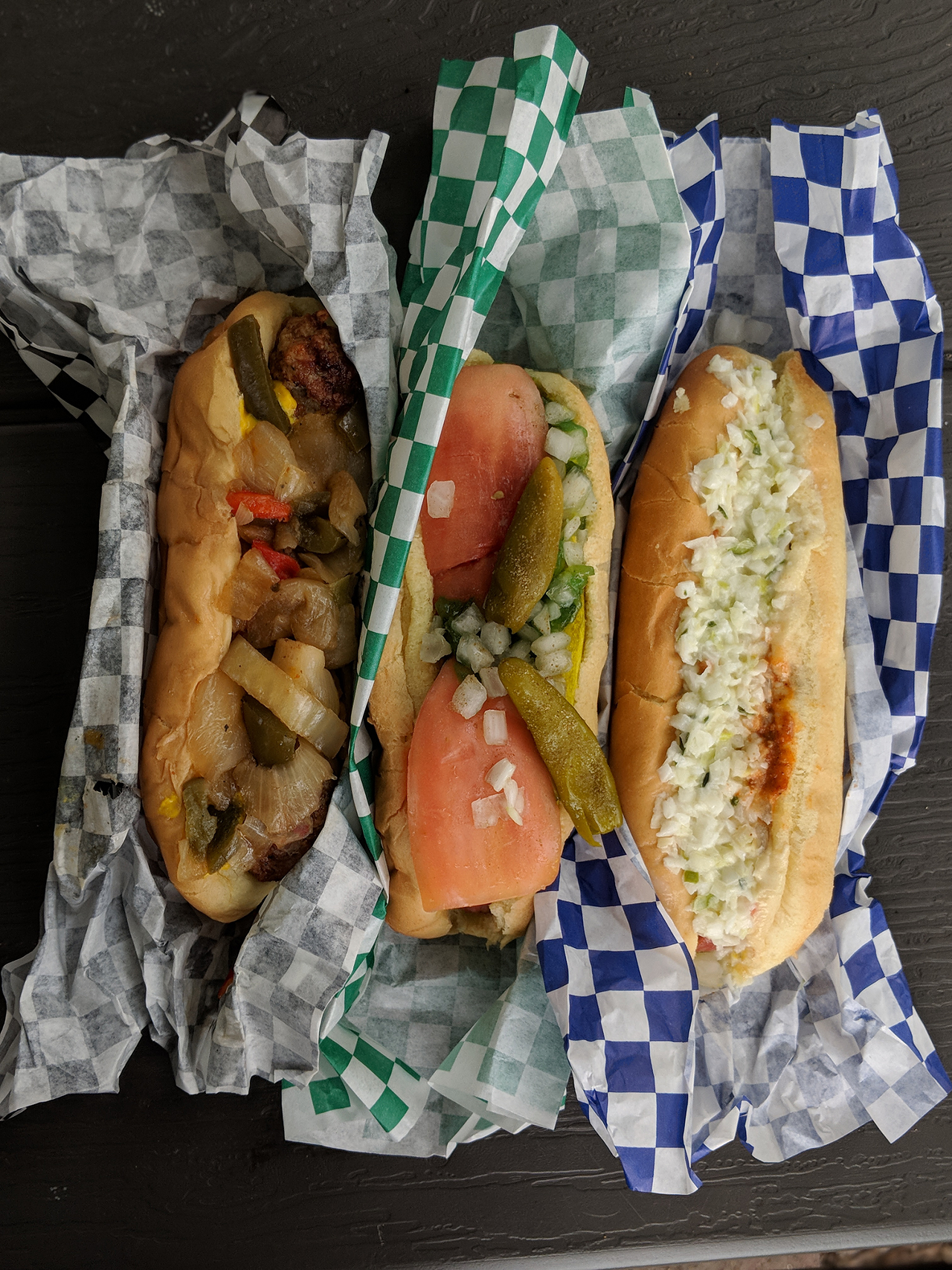 (From left to right) Mr. Gene's Italian Sausage Sandwich, Chicago Dog and Slaw Dog