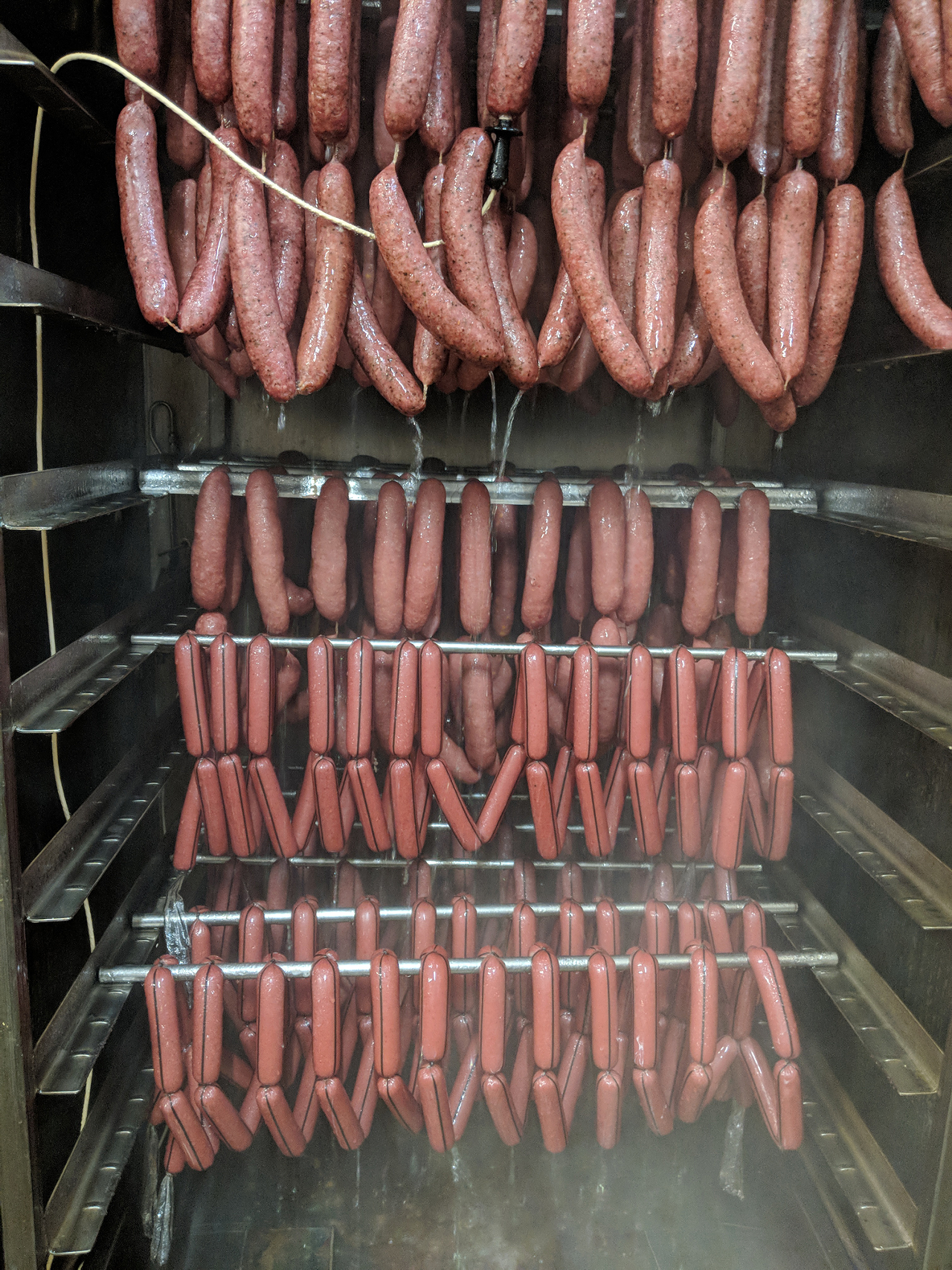 Hot dogs and sausages steaming in Avril-Bleh's steam room.