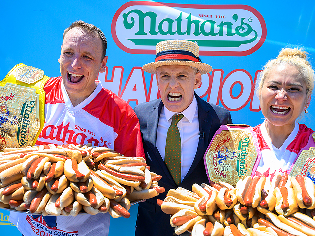 Joey Chestnut (left) winning his 14th Nathan’s Famous Hot Dog Eating Contest by consuming 76 hot dogs within 10 minutes.