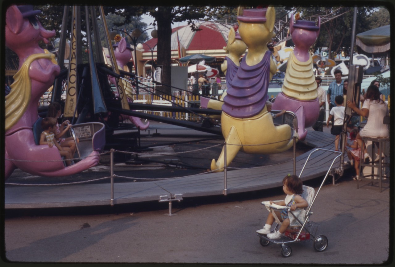 A child in a stroller at Coney Island, 1970