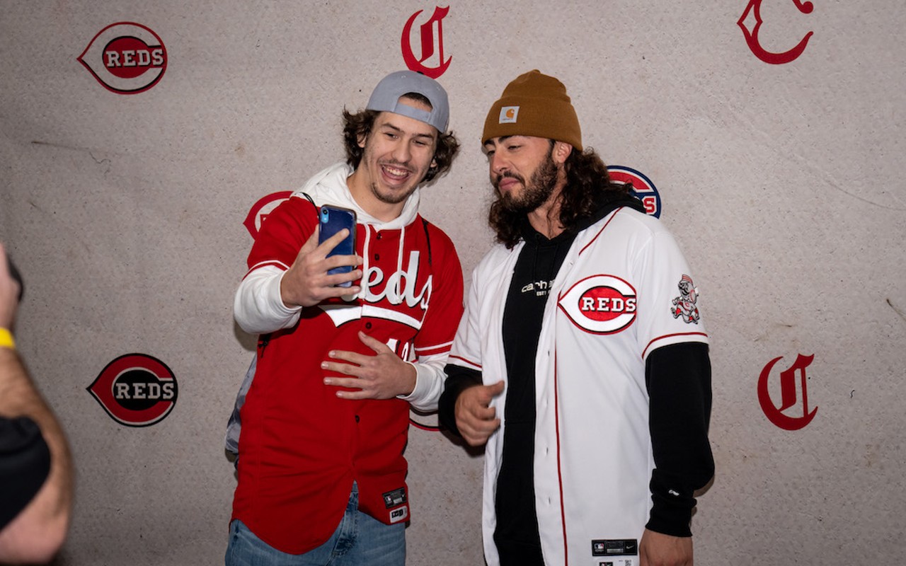 Cincinnati Reds second baseman Jonathan India (right) poses with a fan during Redsfest, held at Duke Energy Center downtown Dec. 2-3, 2022.