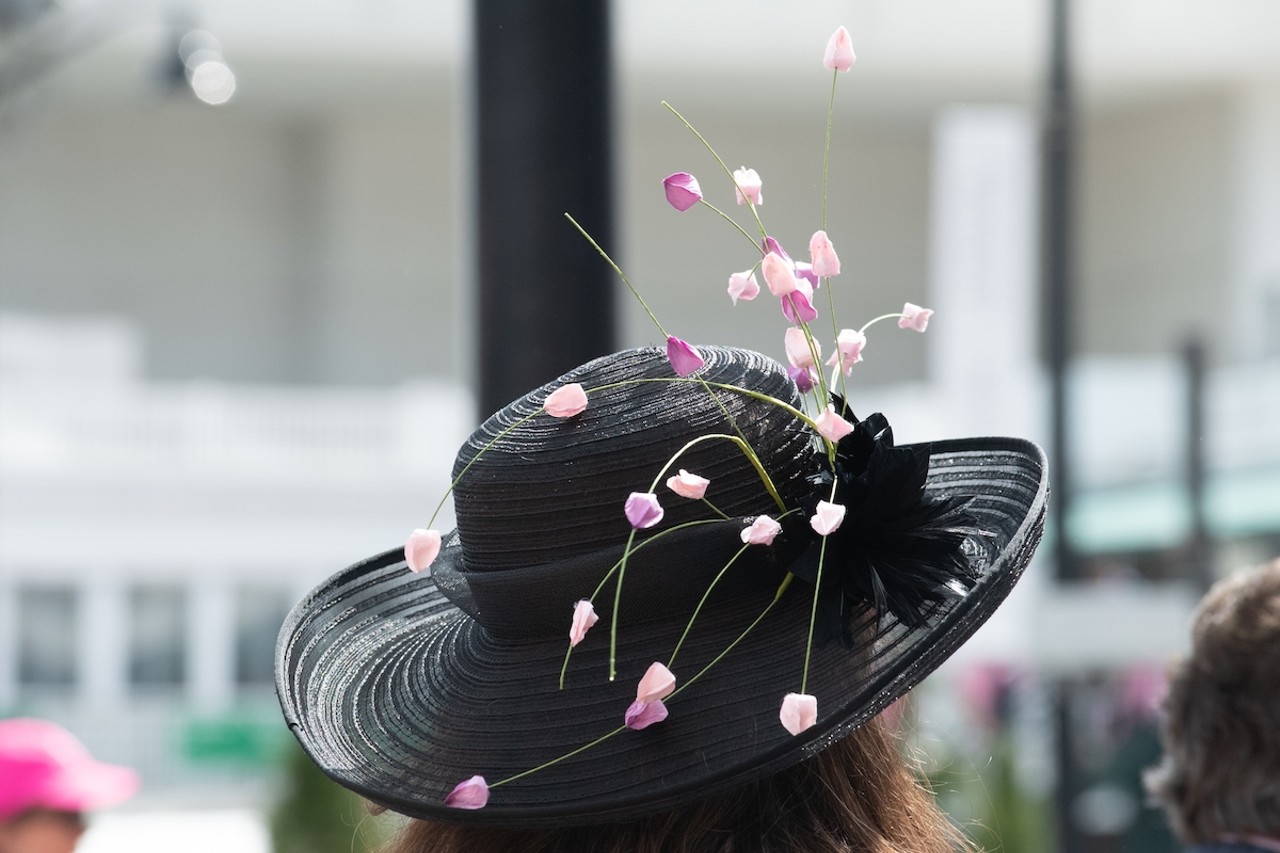 Hyde Park
Indian Hill’s chiller, but still pretty moneyed, cousin Hyde Park is a little less flashy with its money. This hat is elegant in an understated way and the little purple buds bring to mind Ault Park’s (technically in neighboring Mt. Lookout) springtime cherry blossoms.