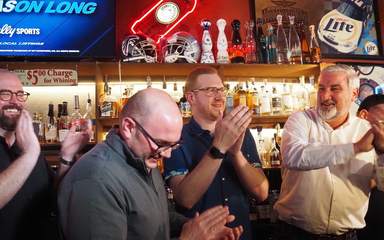 From left to right: Sen. Justin Busch, Reps. Jake Teshka and Ethan Manning, and Indiana Gov. Eric Holcomb celebrate legislation legalizing happy hours at the Whistle Stop Inn in Indianapolis, Indiana on March 14, 2024.
