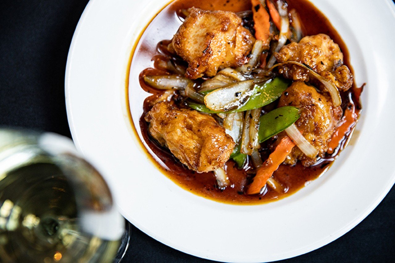 New Chicken ($17), batter-fried chicken with onions, carrots, and snow peas in homemade Szechuan sauce