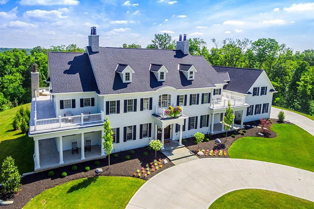 7998 Ayers Road, Anderson Township
$3,200,000 | 5 bd/7 ba | 9,234 sq. ft. | Year Built: 2018
This Georgian Estate-esque abode features nearly 10,000 square feet, with plenty of rooms for entertaining; an open floor plan; an expansive, bright kitchen; a lavish basement bar with a wine room; and a beautiful patio overlooking the pool. The estate has a gated private driveway that leads up to the six-acre wooded lot, surrounded by mature trees.