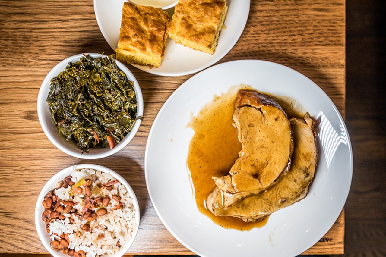 In this photo: braised greens, delta rice and field peas, cornbread and sweet-tea-brined turkey