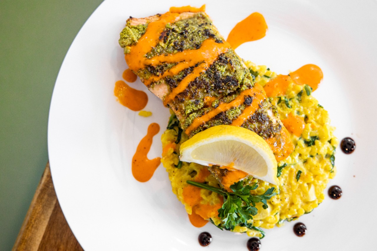 Pistachio and herb salmon ($28): Atlantic salmon crusted with Turkish pistachios and fresh herbs served over saffron risotto, wilted greens and Espelette sauce
