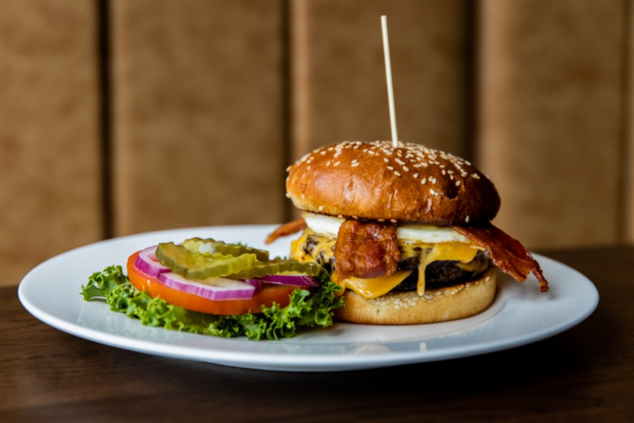 The Royale Goose, a grass-fed burger with American cheese, lettuce, tomato, onion, pickles and Dijonnaise on a sesame bun (single $7.25 / double $11.75, add over-easy egg $1.50, add black pepper bacon $1.50)
