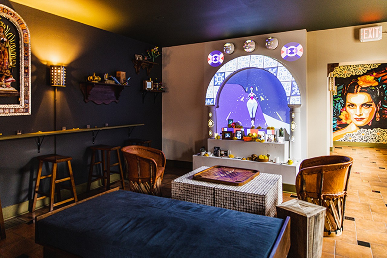 The bar's white altar is magnetized with neon graphics from a state-of-the-art projection system and adorned with pictures of relatives, flowers and candles similar to what you&#146;d find in Mexico on Dia de los Muertos (the Day of the Dead).