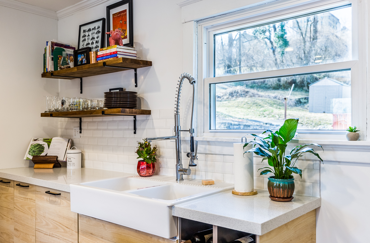 "The sink is also from IKEA. ​We got an awesome deal on the faucet at Bargains & Buyouts ​in Western Hills.​ ​We built the shelves using ​butcher block boards that we cut and stained, and placed on top of ​handmade brackets ​from a seller on Etsy​. The cookbook holder was a handmade gift from Uncle Joe.​" — Chris​