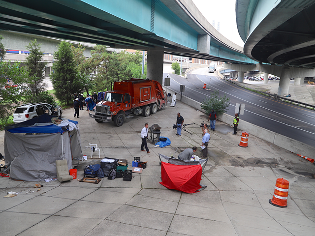 City crews clean up a camp near Lytle Tunnel downtown