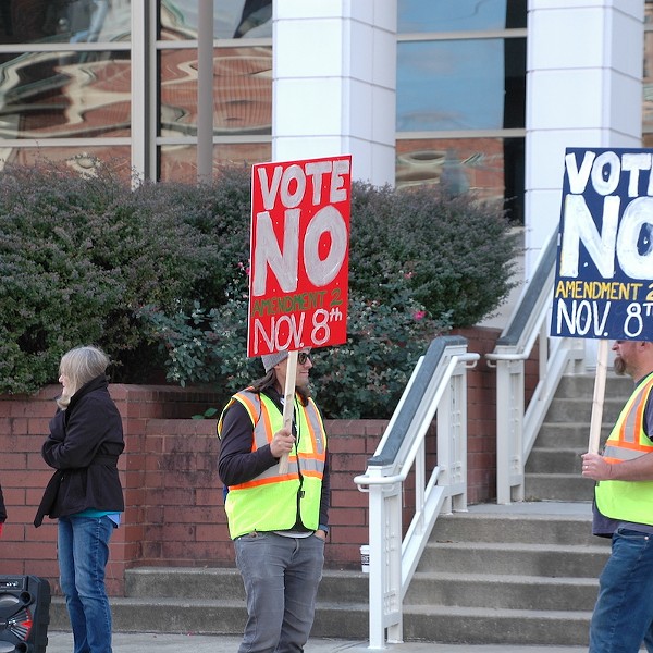 Cars honk as pro-choice demonstrators line Fifth Street in Covington on Oct. 8, 2022.