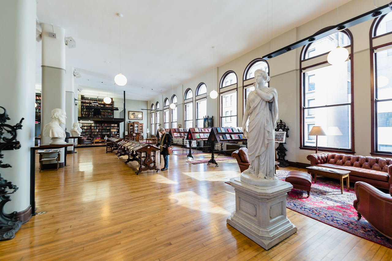 The 8-foot-tall statue, “Silence,” greets visitors as they enter the 11th-floor library.