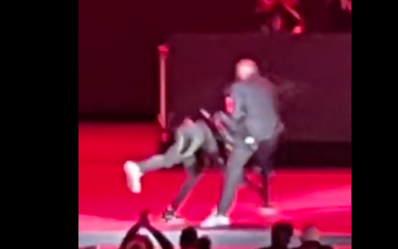 Isaiah Lee rushes Dave Chappelle on stage during Chappelle's May 3 performance at the Netflix Is a Joke festival at the Hollywood Bowl.