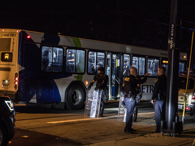 A Cincinnati Metro bus being used to transport arrested protestors last night