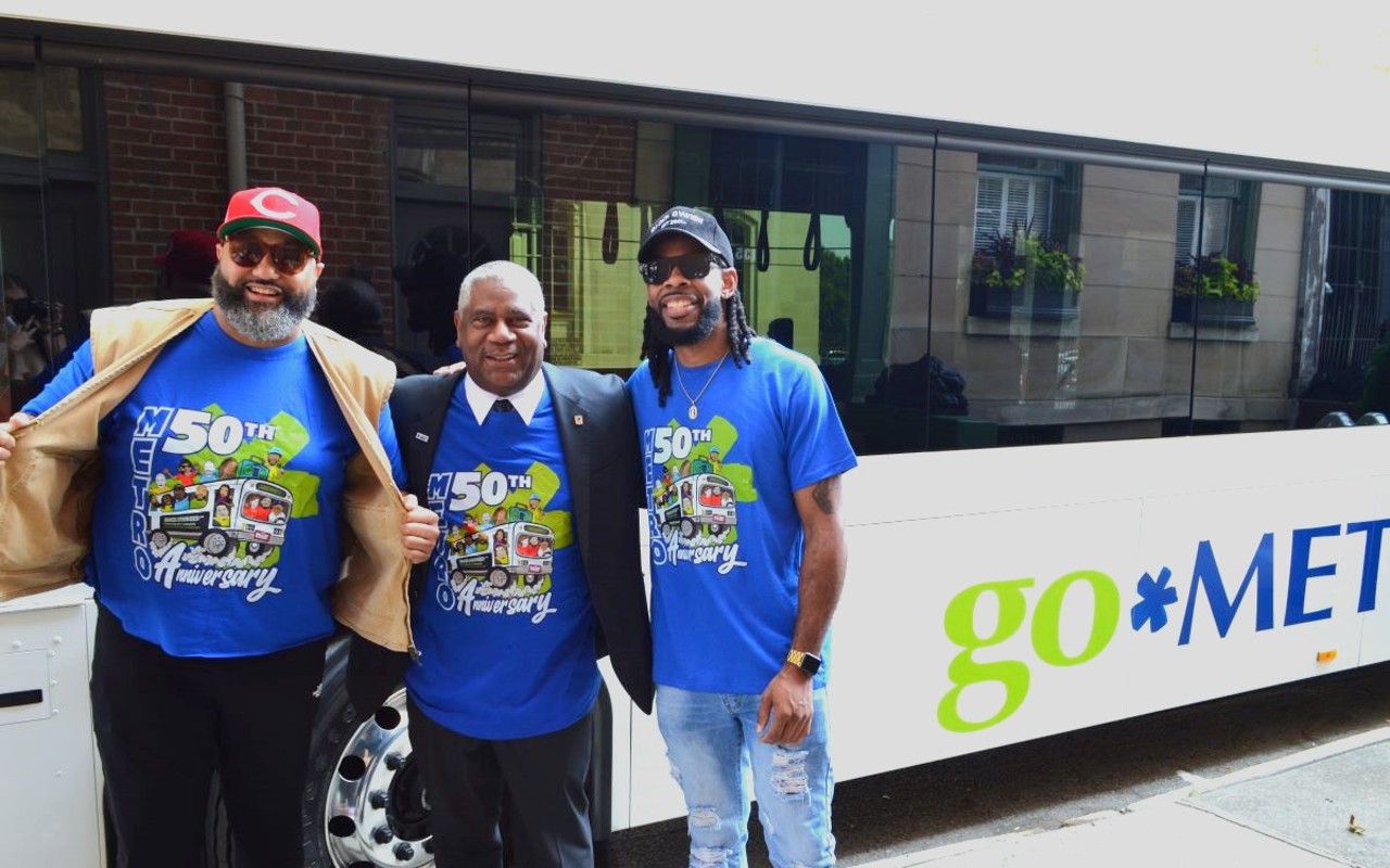 Metro CEO (middle) Darryl Haley and Paloozanoire founder Rico Grant (left) pose with community influencer, wearing the new commemorative T-shirt.