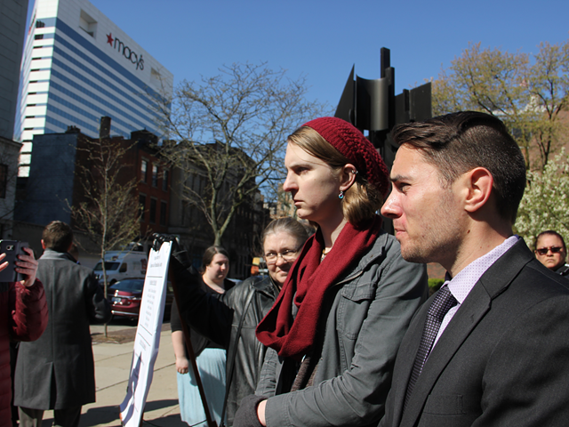 Rachel Dovel and her attorney Josh Langdon hold a news conference outside the Public Library of Cincinnati and Hamilton County