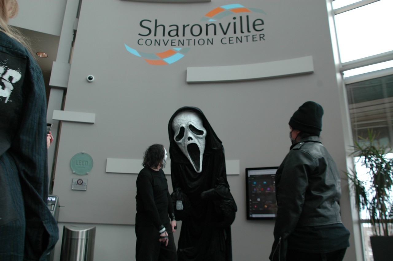 A giant Ghostface from Scream delights attendees with photo ops.
