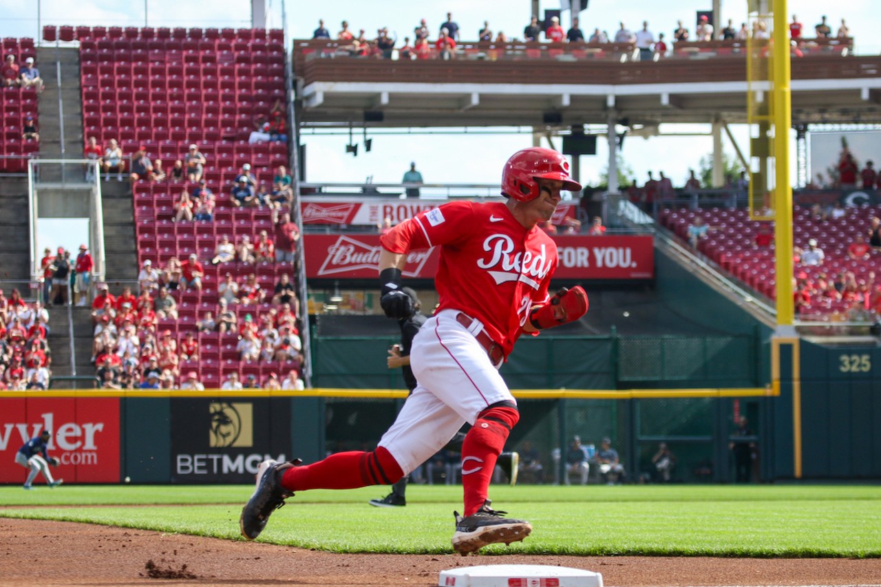 TJ Friedl rounds third off a single by Elly De La Cruz to score in the first inning of the Cincinnati Reds' game against the Seattle Mariners on Sept. 4, 2023.