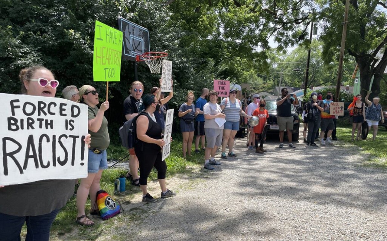 Protesters demonstrate outside the home of Attorney General Dave Yost.