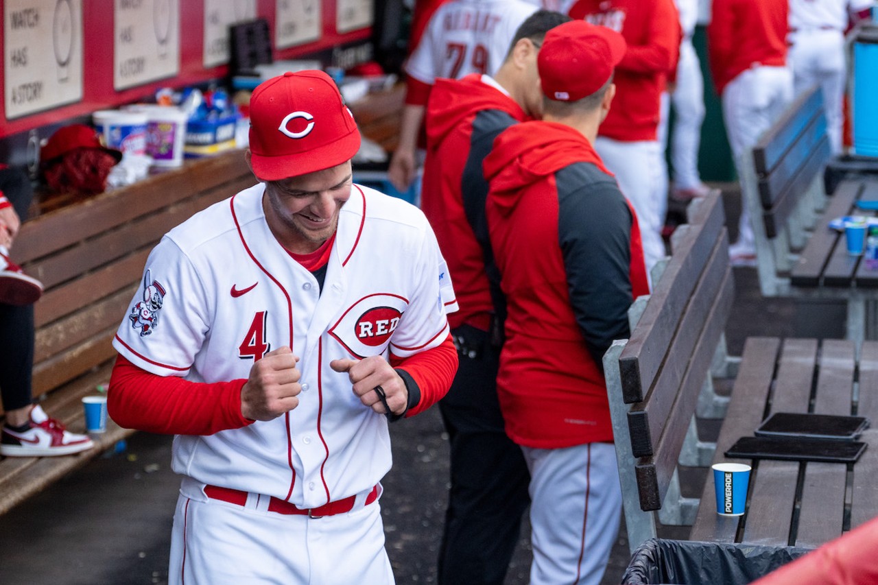 Cincinnati Reds outfielder Wil Myers smiles in the dugout during the season opener at Great American Ball Park on March 30, 2023.